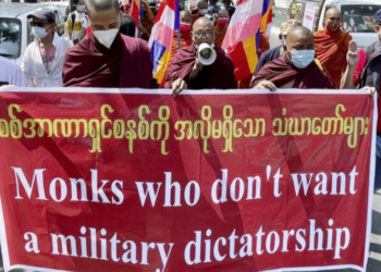Monks protest against the military coup in Yangon on Feb. 16. / Kyodo