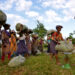 Tea garden workers gather to weigh tea leaves after plucking them at a tea estate in Nagaon district, Assam, India on Nov. 2 / Anuwar Hazarika / Reuters