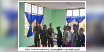 Thai officials present to their Myanmar counterparts a list of human trafficking victims at a transfer ceremony in the border town of Myawaddy, Karen State on Oct. 18, 2019. / Myanmar Ministry of Home Affairs.