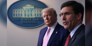 US Secretary of Defense Mark Esper speaks as US President Donald Trump listens at a White House press briefing on April 1, 2020 in Washington. / GETTY / KYODO