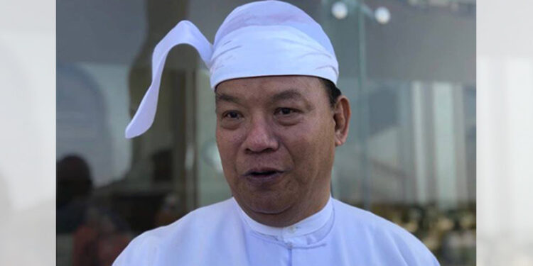 USDP lawmaker U Tin Aye talks to the media after a Lower House session on Monday. / The Irrawaddy