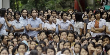 Workers from Myue & Soe Garment factory stand during a protest for salary increment in front of the Mayangone township labor office in Yangon in 2012 / Soe Zayar Tun / The Irrawaddy