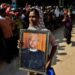 A woman carries a portrait of slain lawyer U Ko Ni at his funeral in Rangoon on Jan. 30. / Pyay Kyaw / The Irrawaddy