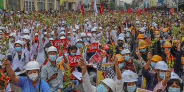 Thousands of Mandalay residents stage a sit-in protest against the military regime on Sunday, following a deadly police crackdown a day earlier. / The Irrawaddy