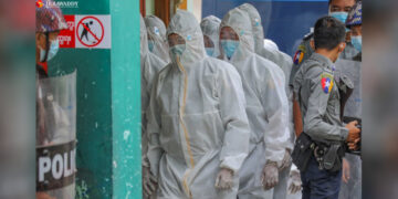 Michael Kyaw Myint in PPE arrives at Chanmyathazi Township Court in Mandalay on Oct. 23, 2020. / Zaw Zaw / The Irrawaddy