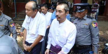Zeya Phyo (right) and Aung Win Tun (left) attend their trial at the Yangon Northern District Court. / Myo Min Soe / The Irrawaddy