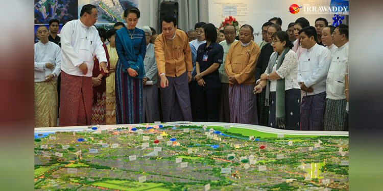 State Counselor Daw Aung San Suu Kyi attends the launch of a government public housing development project in Yangon on Dec. 24, 2016. / Hein Htet / The Irrawaddy