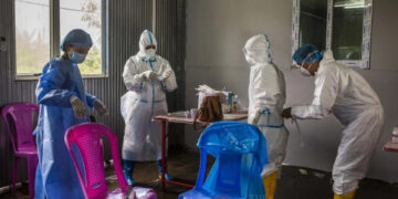 Healthcare workers are seen at a COVID-19 center prior to the ousting of the National League for Democracy government. / The Irrawaddy