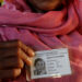 A Rohingya refugee woman poses after receiving an ID card from the Bangladesh army in a camp near Cox's Bazar, Bangladesh, on Oct. 10. / Reuters