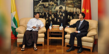 U Kyaw Myint of the UDP with the Chinese ambassador to Myanmar in December 2013. / Chinese Embassy Facebook