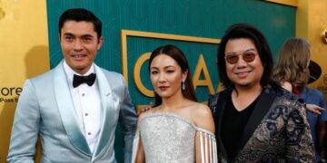 Author Kevin Kwan (R) and cast members Henry Golding and Constance Wu pose at the premiere for "Crazy Rich Asians" in Los Angeles, California, US, Aug. 7, 2018. / Reuters