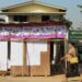 A woman walks past the voter lists on display in Hlaing Tharyar Township, Rangoon Division, Feb. 1, 2017. / Chan Son / The Irrawaddy