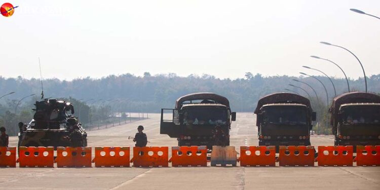 Myanmar soldiers and an armored personnel carrier are seen on the road to the Parliament and President’s Office in Naypyitaw, the capital of Myanmar, on Feb. 1, 2021. / The Irrawaddy