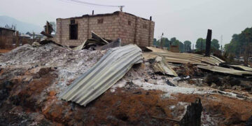 Feature photo caption: A house damaged by the fighting between RCSS and TNLA.