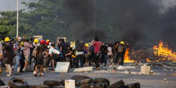 Anti-regime protesters resist soldiers and police in Yangon in March. / The Irrawaddy