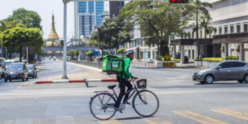 A rider from GrabFood is seen in downtown Yangon in March 2020. / The Irrawaddy