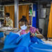 Garment workers make surgical gowns at the Shwepyithar Industrial Zone in Yangon in May 2020. / Htet Wai / Irrawaddy