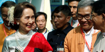 State Counselor Daw Aung San Suu Kyi arrives at the Rakhine State Investment Fair in Ngapali, Thandwe Township, Rakhine State, on Friday. / Reuters