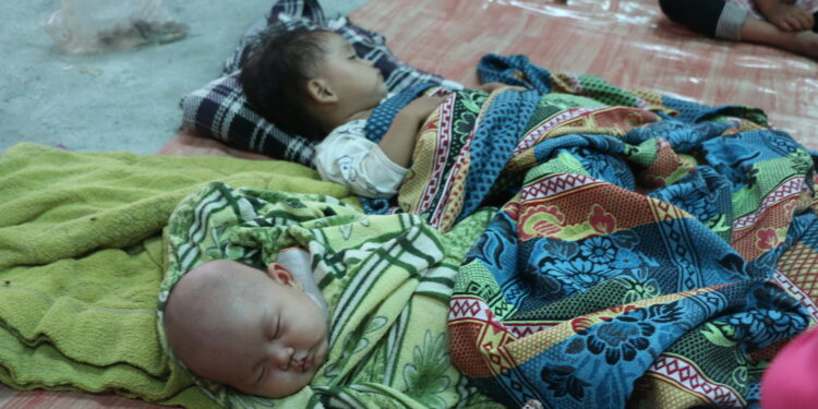 Children take a nap at a shelter providing a temporary home for displaced persons in Myaing Gyi Ngu village. / Hsa Moo