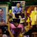 Well-wishers hold pictures of Thailand’s King Bhumibol Adulyadej as they pray for him at the Siriraj hospital where he is residing in Bangkok, on Oct. 12. / Athit Perawongmetha / Reuters
