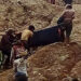 Rescuers remove the body of a prospector killed in the collapse of a waste pile in the Lone Khin jade mining region of Kachin State on Saturday. / Nawng Latt