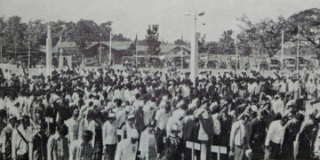 People sing the national anthem during the 1981 Union Day in Pathein Township.