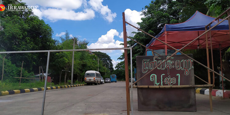An official barricade blocks the road leading to staff housing for the Ministry of Religious Affairs and Culture in Naypyitaw. / The Irrawaddy