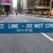 A street in New York is blocked by police amid the COVID-19 pandemic. / GETTY / KYODO