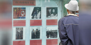 Various photos depicting China's past relations with North Korea are on display in front of the Chinese Embassy in Pyongyang on Oct. 5, 2019, the eve of the 70th anniversary of the establishment of the bilateral ties. / Kyodo