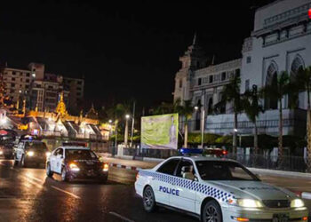 Police carry out a nighttime patrol in Yangon after the authorities imposed a curfew on April 19. / Aung Kyaw Htet / The Irrawaddy