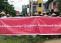 Farmers in Demoso Township, Kayah State, hold a silent protest against military land seizures in the middle of town on Thursday, July 4 2019. / Kayah Youth Meeting Point / Facebook