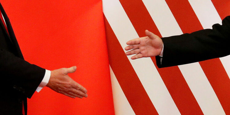US President Donald Trump and China's President Xi Jinping shake hands after making joint statements at the Great Hall of the People in Beijing, China on November 9, 2017. / REUTERS
