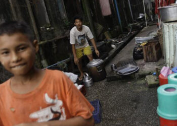 Youth at work at a teashop in Yangon. / Reuters