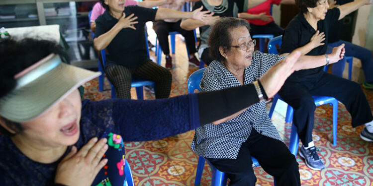 People exercise at an elderly center in Bangkok, Thailand, on June 27. / Reuters
