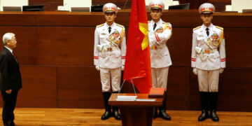 Vietnam's Communist Party General Secretary Nguyen Phu Trong stands at attention after being elected as Vietnam's State President during a National Assembly session in Hanoi, Vietnam, October 23, 2018. / Reuters