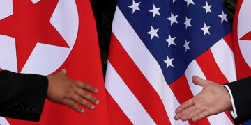 U.S. President Donald Trump and North Korean leader Kim Jong Un meet at the start of their summit at the Capella Hotel on the resort island of Sentosa, Singapore, on June 12. / Reuters