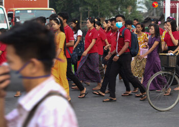 Workers are seen during rush hour in Hlaing Tharyar Township in Myanmar's Yangon Region in April. / Myo Min Soe