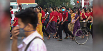 Workers are seen during rush hour in Hlaing Tharyar Township in Myanmar's Yangon Region in April. / Myo Min Soe