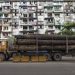 A cargo truck transports logs in Yangon in 2016.