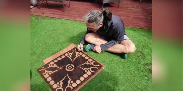 Son of Myanmar’s Detained Suu Kyi Creates Carving to Support Myanmar People