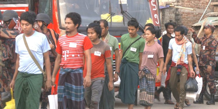 Myanmar junta troops, border police and immigration officials who had fled to Bangladesh boarded a Myanmar naval vessel near Cox’s Bazar ahead of repatriation to their home country on April 25, 2024. / Mohibullah Muhib