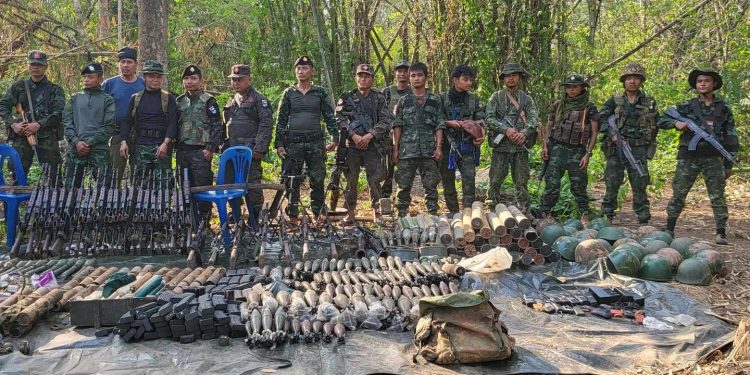 KNLA and PDF troops pose with weapons and ammunition seized after capturing Maw Hta base in Dawei Township on Wednesday. / KNLA 