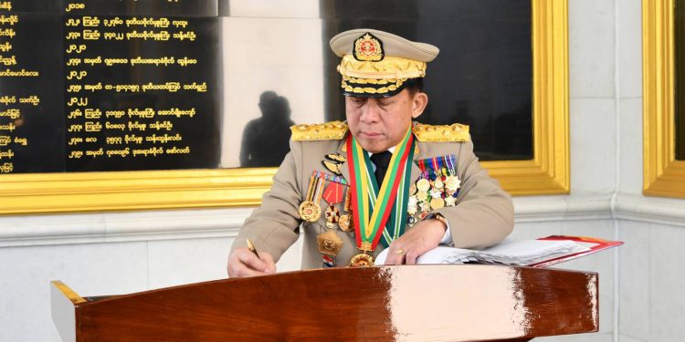 Myanmar regime chief Min Aung Hlaing, weighed down with medals during a public appearance. / Cincds