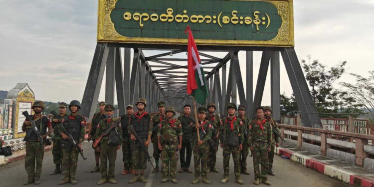 KIA and allied forces are seen on the Sin Khan Bridge after seizing junta military outposts around it on May 7, 2024. / Kachin Mountain       