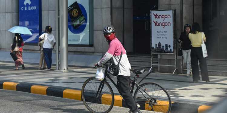 With Motorbikes Banned, Yangon Delivery Riders Struggle in Heatwave