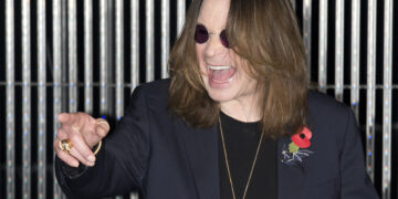 British singer Ozzy Osbourne poses for pictures as he arrives for the 2014 MTV Europe Music Awards (EMA) in Glasgow, Scotland on Nov. 9, 2014. / AFP