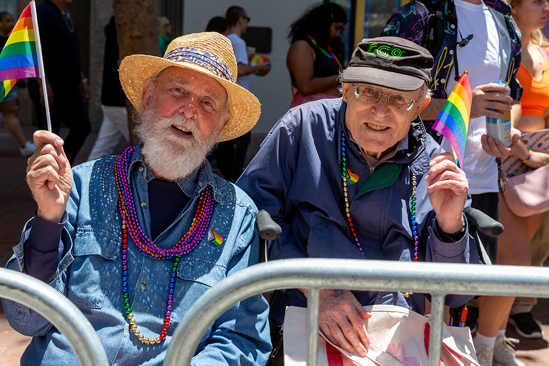 A couple who have been together for over 50 years enjoy the parade.